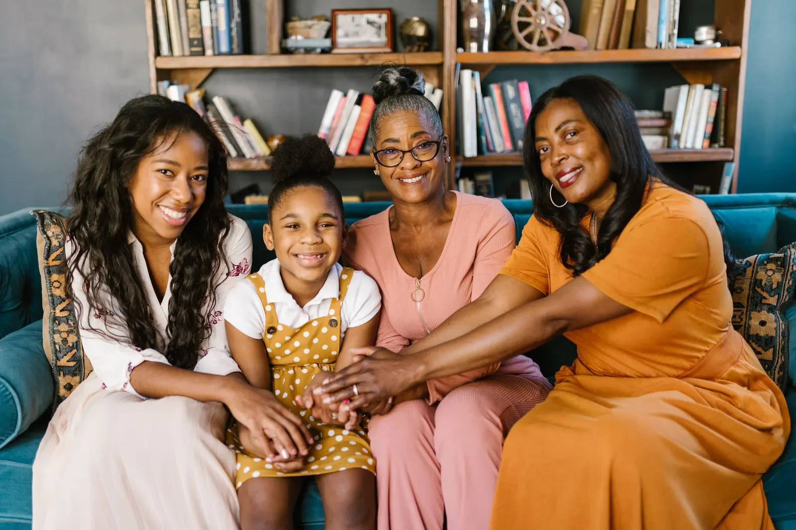 Women of different ages and backgrounds sitting together and smiling